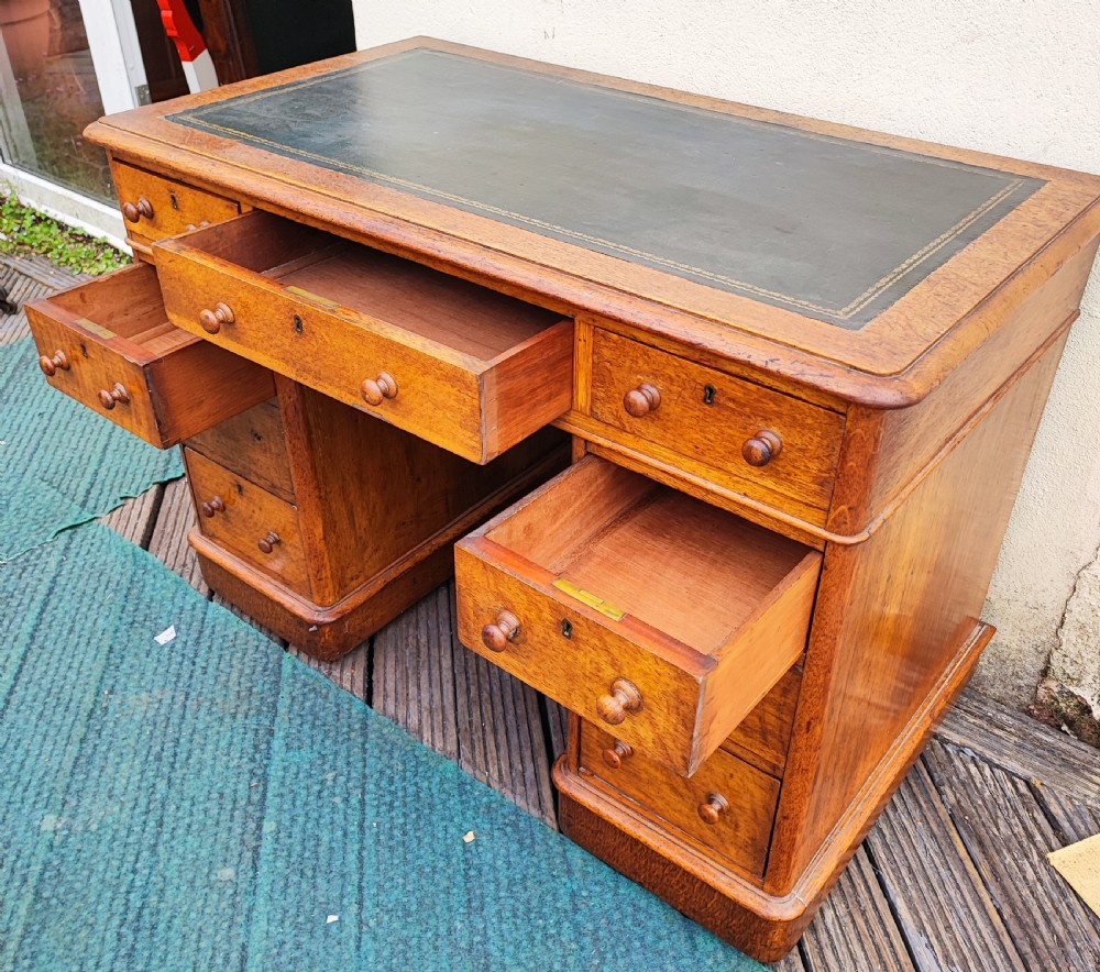 A Victorian oak pedestal desk. View XI