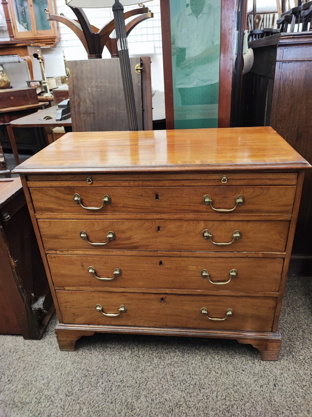 Georgian mahogany chest of drawers with brushing slide. View IV