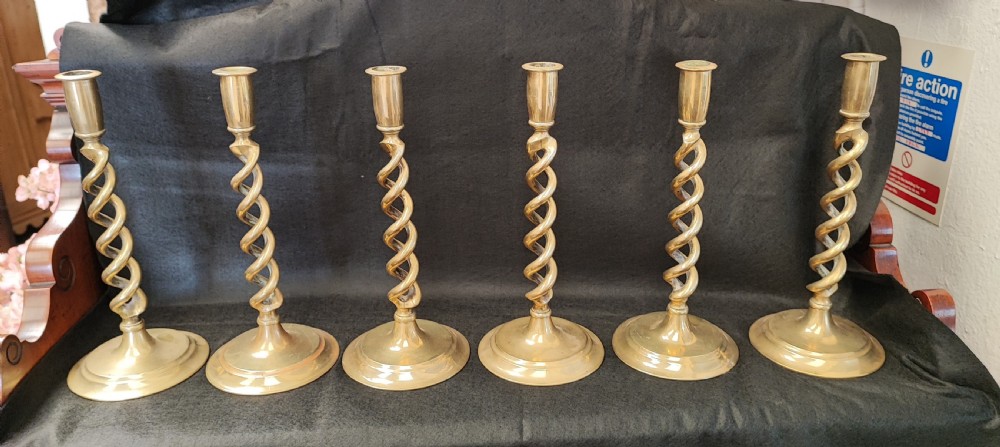 Superb set of 6 matching brass candlesticks. View II