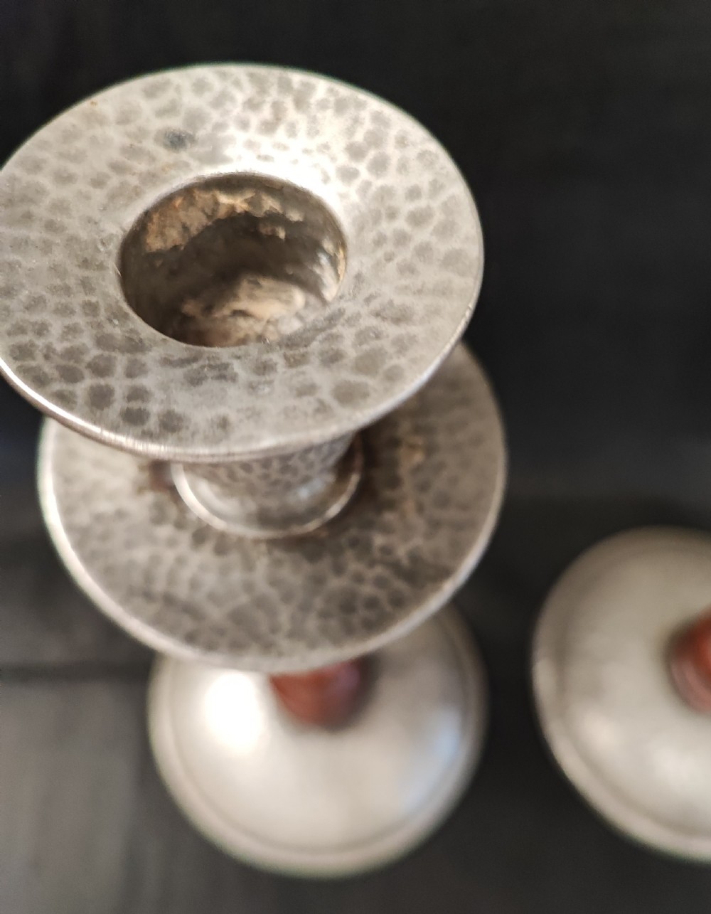 A liberty's style pair of pewter and oak candlesticks. View II