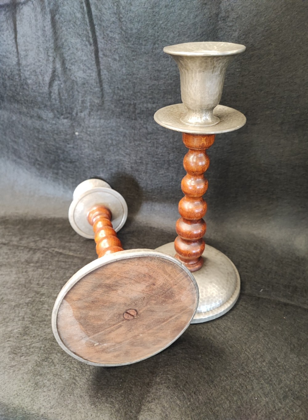 A liberty's style pair of pewter and oak candlesticks. View III