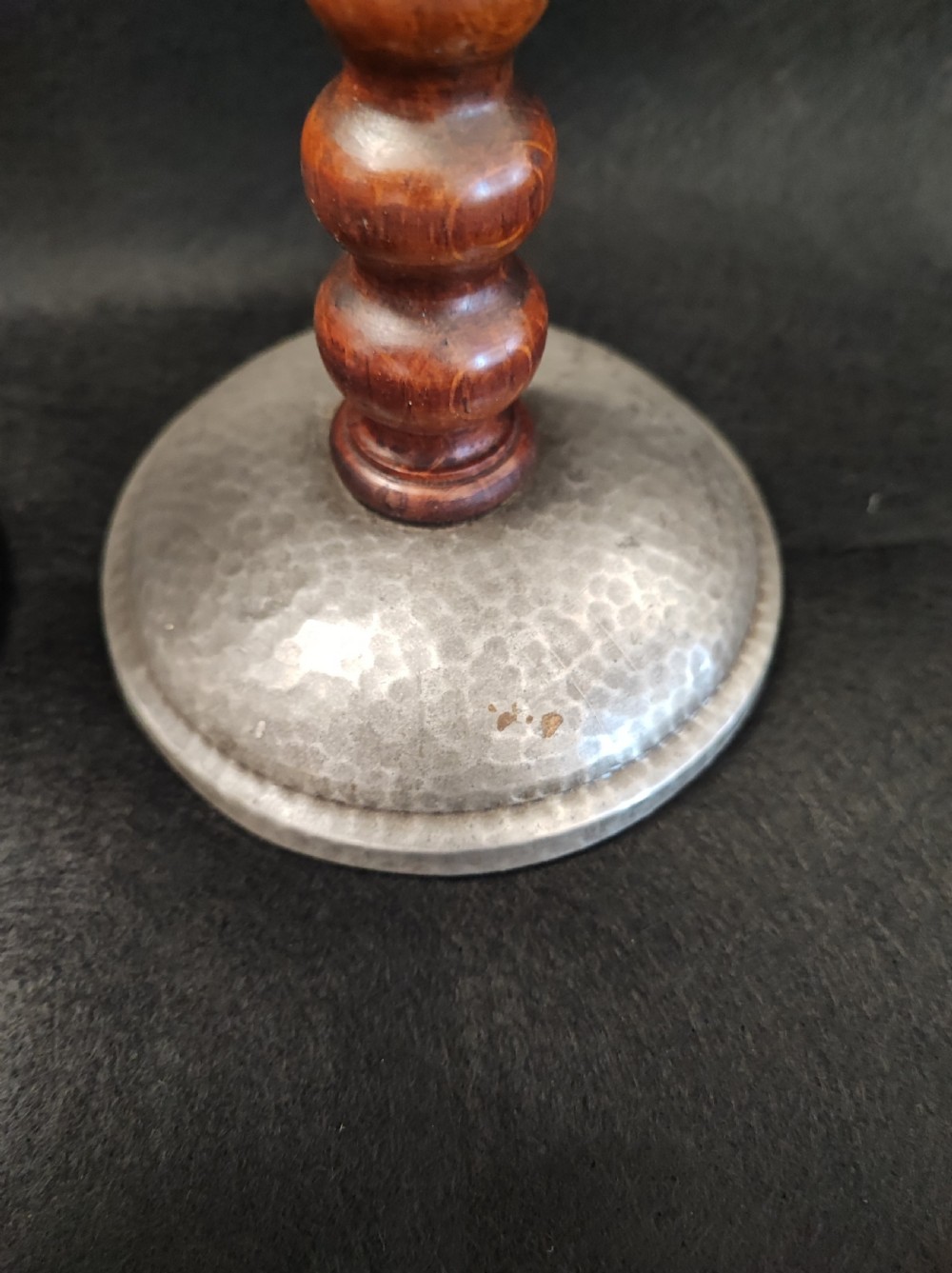 A liberty's style pair of pewter and oak candlesticks. View IV