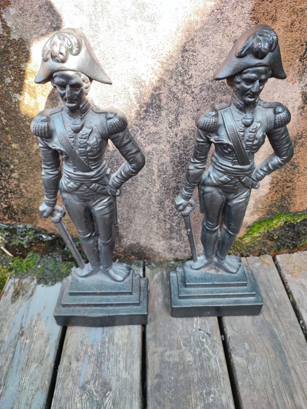 A pair of cast iron Victorian doorstops depicted as military officers in full uniform standing on stepped bases. View IV