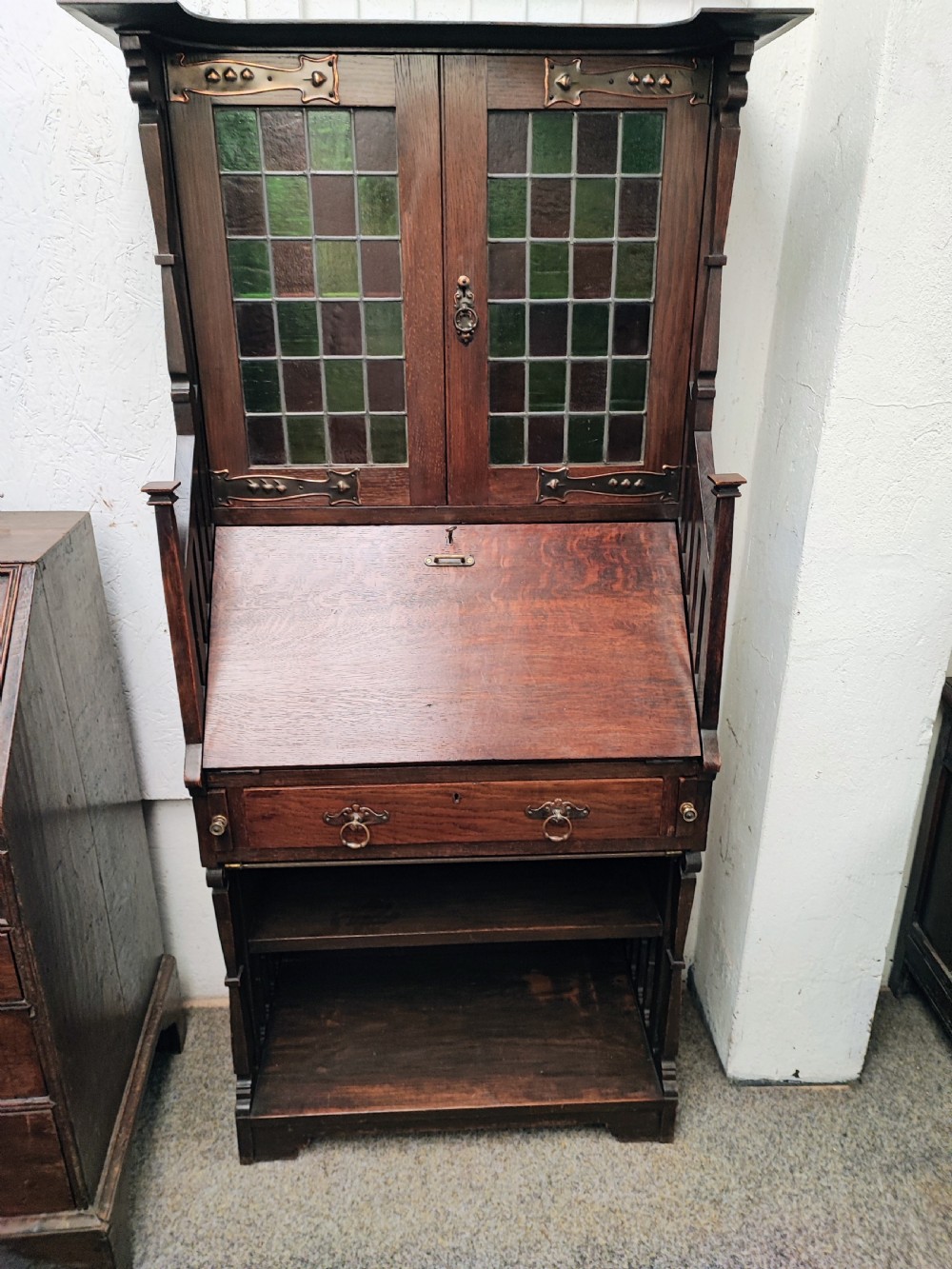 Fine example of an art's and crafts oak bureau bookcase.