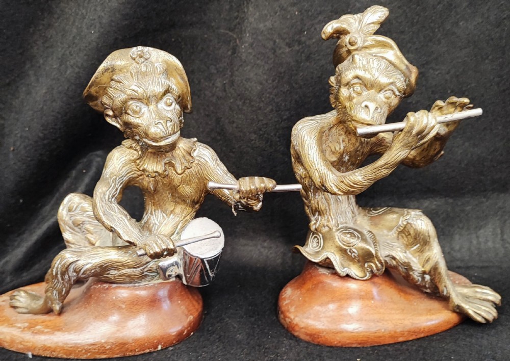 Antique pair of  brass monkey musicians