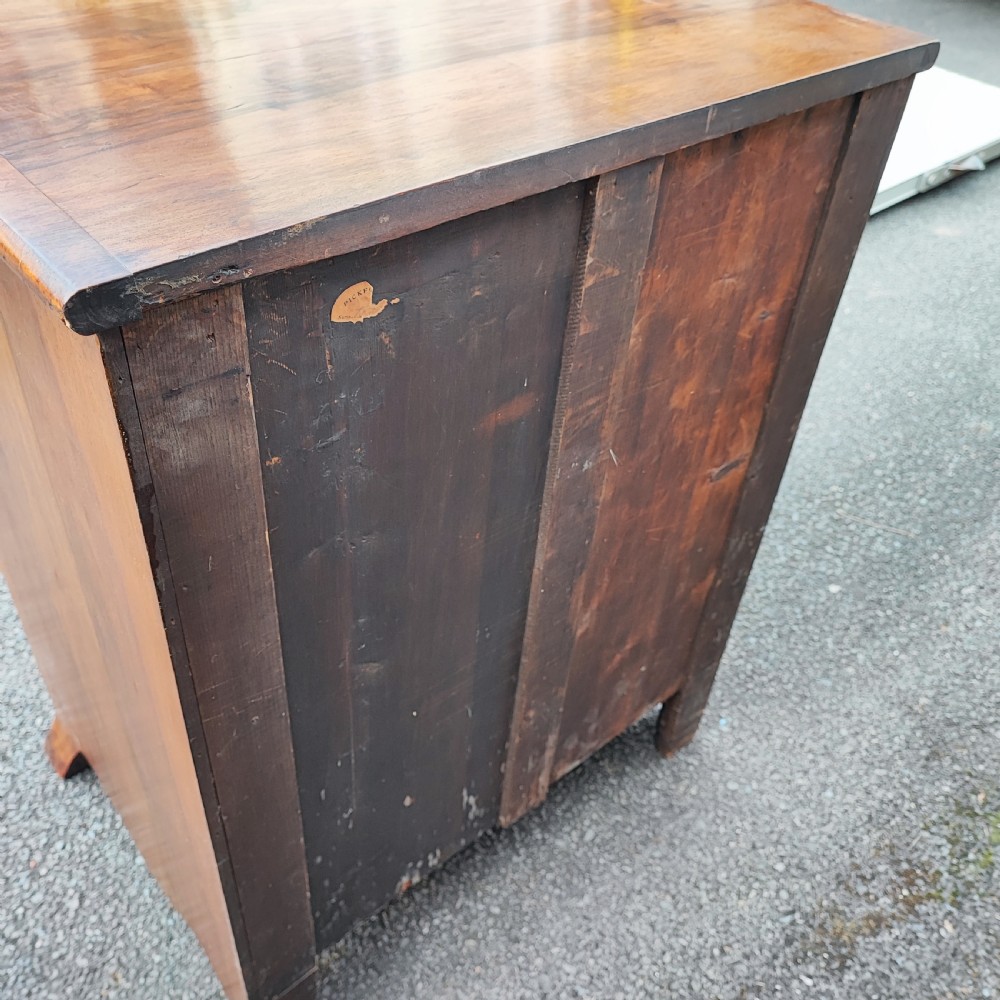 A quality serpentine walnut chest of drawers View VI