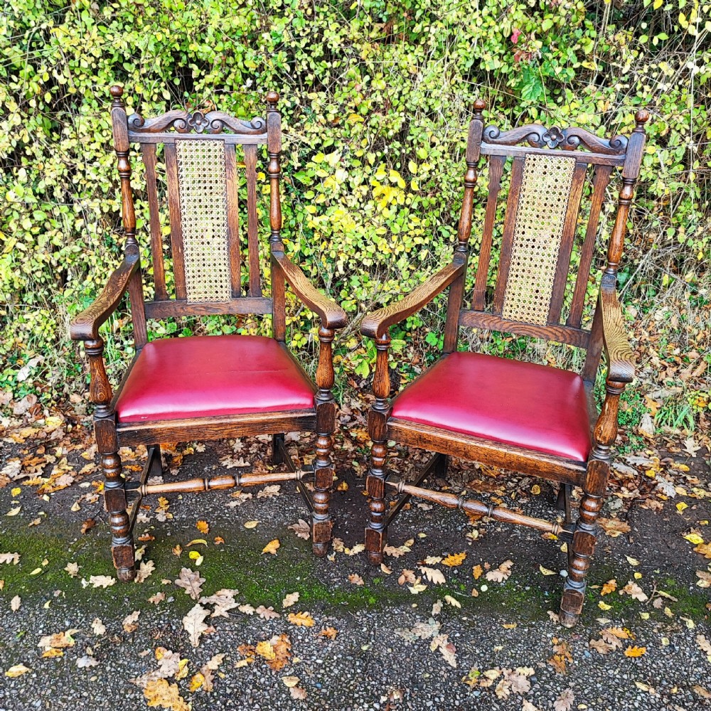 Good antique pair of oak arm chairs 