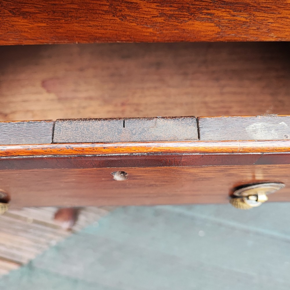 An antique dark oak small dresser featuring an open shelving unit with side cupboards over a two-drawer base raised on cabriole legs. View II