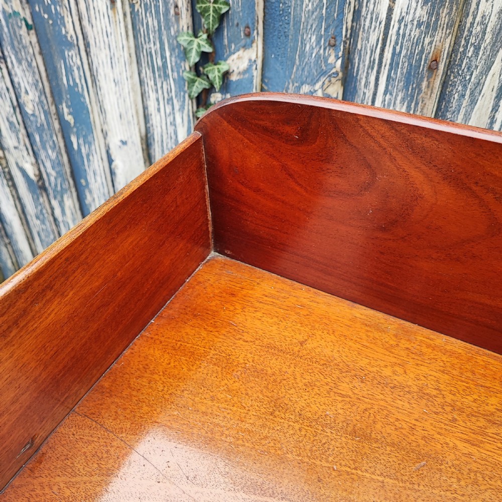 A small Victorian mahogany chest of drawers featuring a rear gallery upstand, two short over two long drawers, and round turned wooden handles. View III