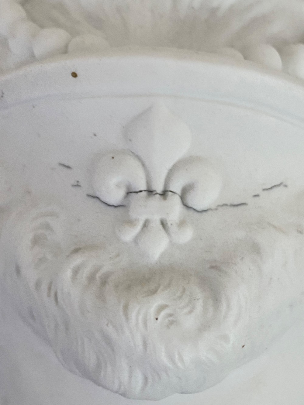 An unglazed white biscuit porcelain portrait bust of Marie Antoinette mounted on a circular cobalt blue and gilded porcelain socle base. View VIII