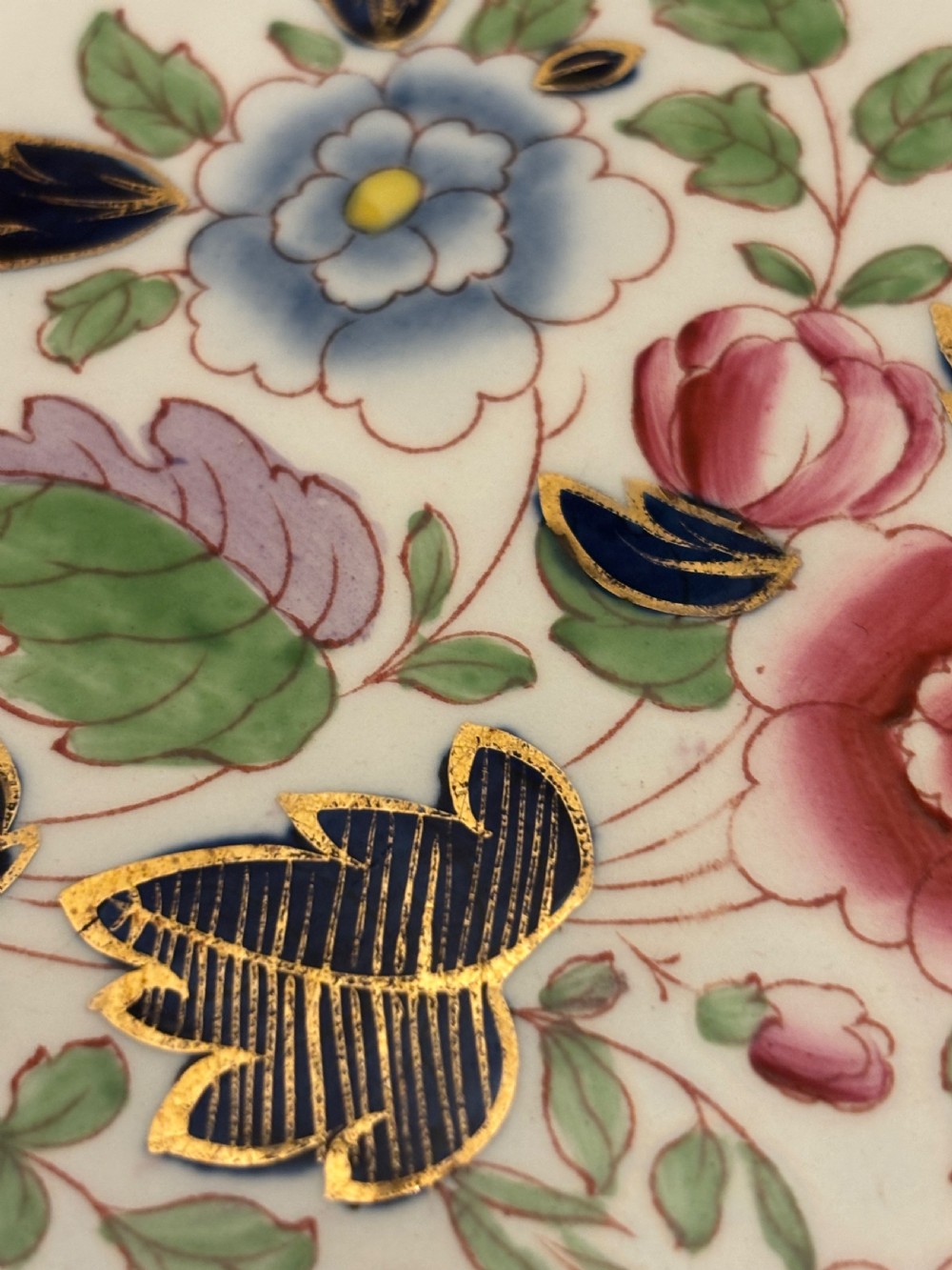 An extensive antique ceramic dinner service featuring floral transfers, matching tureens, bowls, and serving platters arranged together. View II