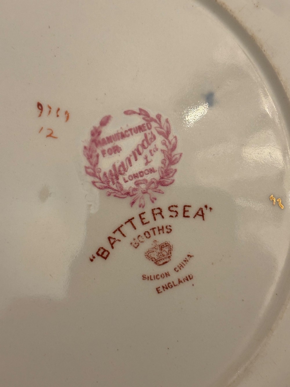 An extensive antique ceramic dinner service featuring floral transfers, matching tureens, bowls, and serving platters arranged together. View III