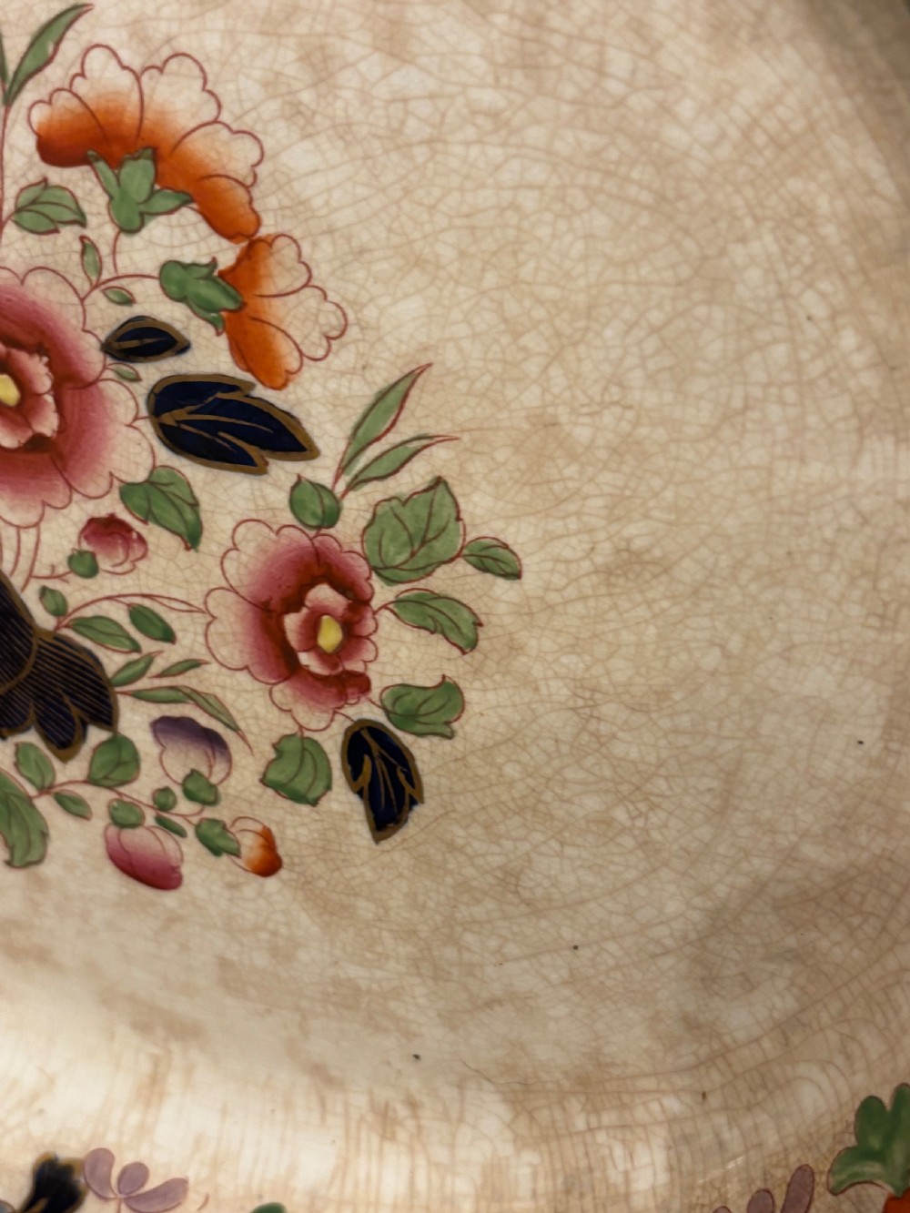 An extensive antique ceramic dinner service featuring floral transfers, matching tureens, bowls, and serving platters arranged together. View XV