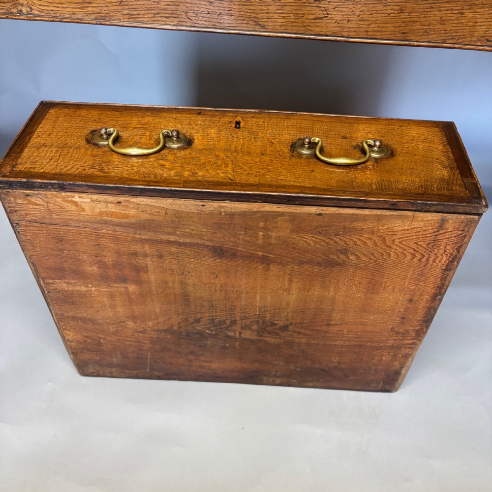 A George III period oak dresser base featuring three drawers with brass swan-neck handles and front cabriole legs. View XV