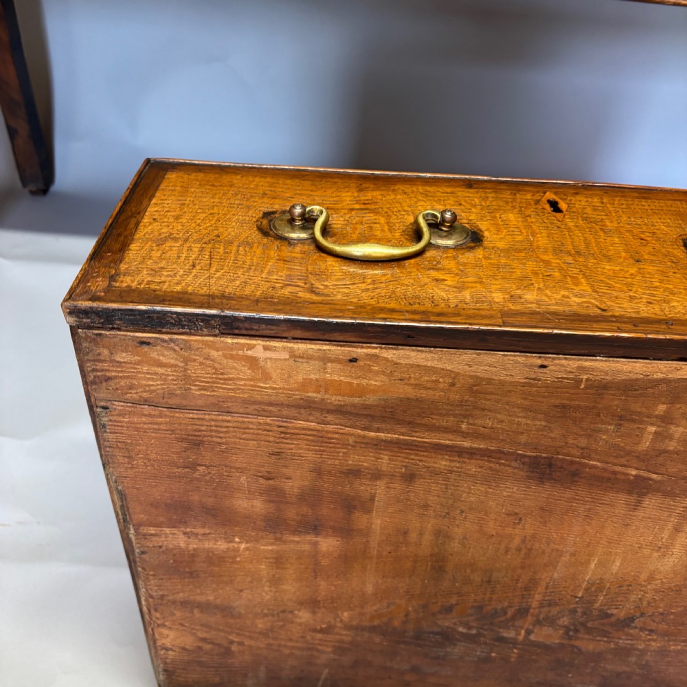 A George III period oak dresser base featuring three drawers with brass swan-neck handles and front cabriole legs. View XVI