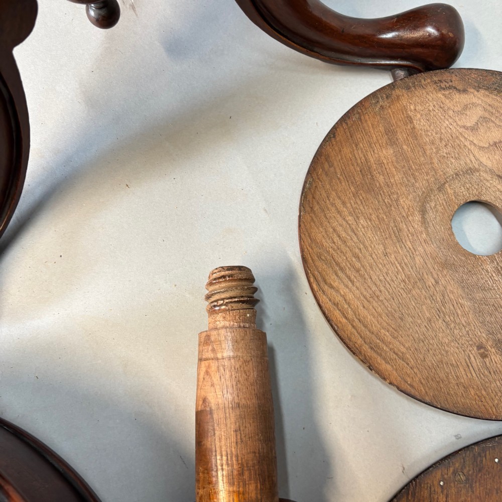 A Victorian dark mahogany shaving stand featuring an adjustable circular mirror, a round tier, a hinged compartment, turned support stem, and tripod cabriole legs. View XIII