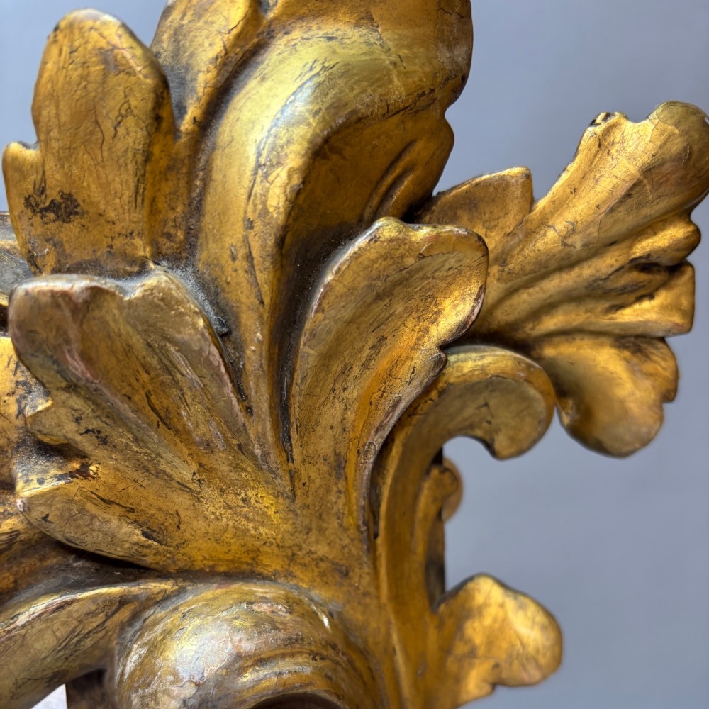 A nineteenth-century rectangular giltwood mirror featuring fluted side columns topped with carved acanthus leaf capitals. View III