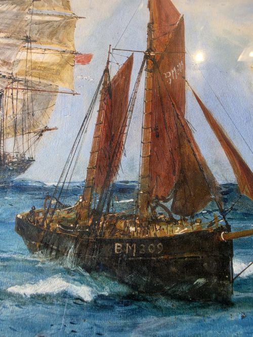 fig 1. A framed 1934 watercolour painting by Charles Edward Dixon featuring a tall sailing ship and a red-sailed vessel navigating choppy blue ocean waters.
