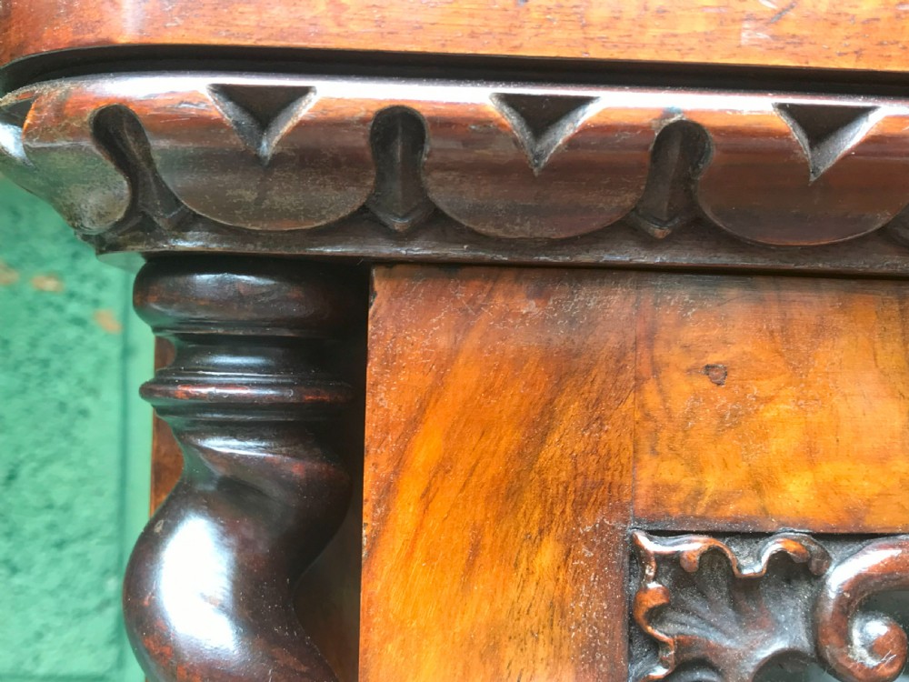 A large two-tier Victorian glazed bookcase crafted in figured walnut with spiral barley twist columns and carved mouldings. View XI