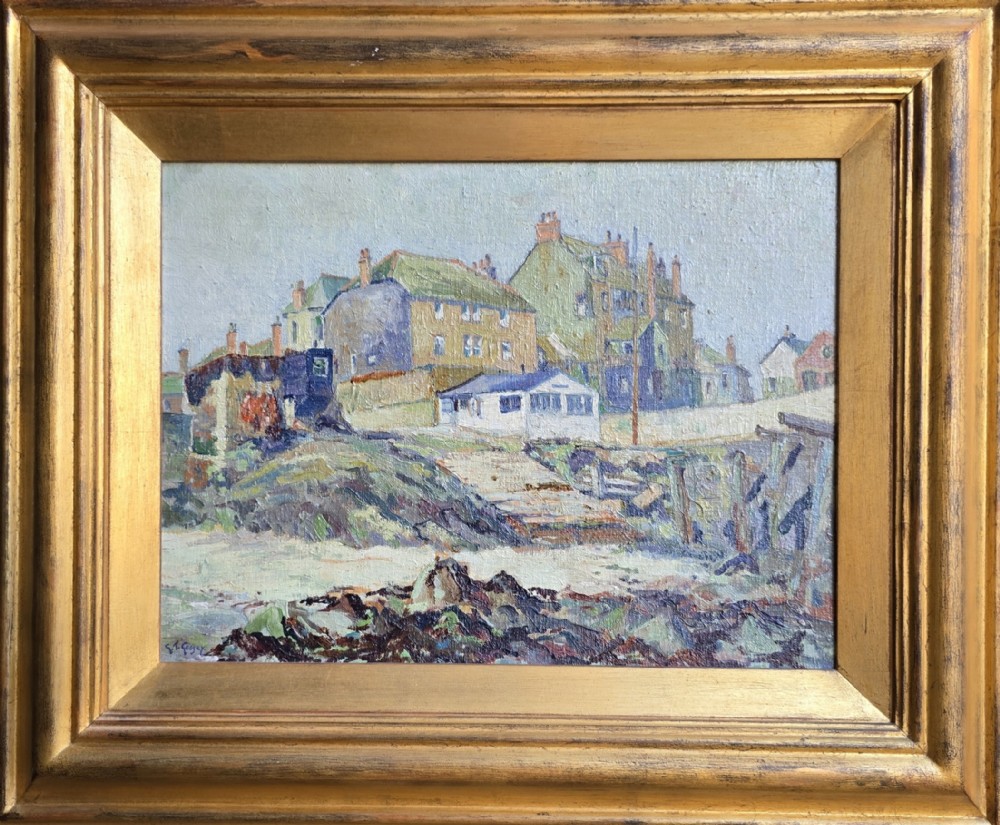 A framed post-impressionist oil painting on canvas depicting a Cornish coastal village scene with cottages on a hill above a beach, enclosed in a gilded moulding frame.