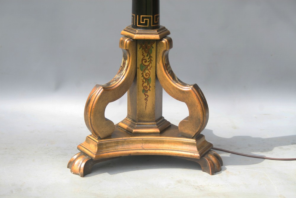 A tall black lacquered standard lamp featuring painted gold dragon motifs on a tapered column supported by a carved tripod base. View VI