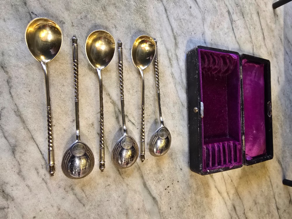 A set of six 1877 Russian niello silver spoons with twisted stems housed in a fitted black display box lined with purple velvet. View IV