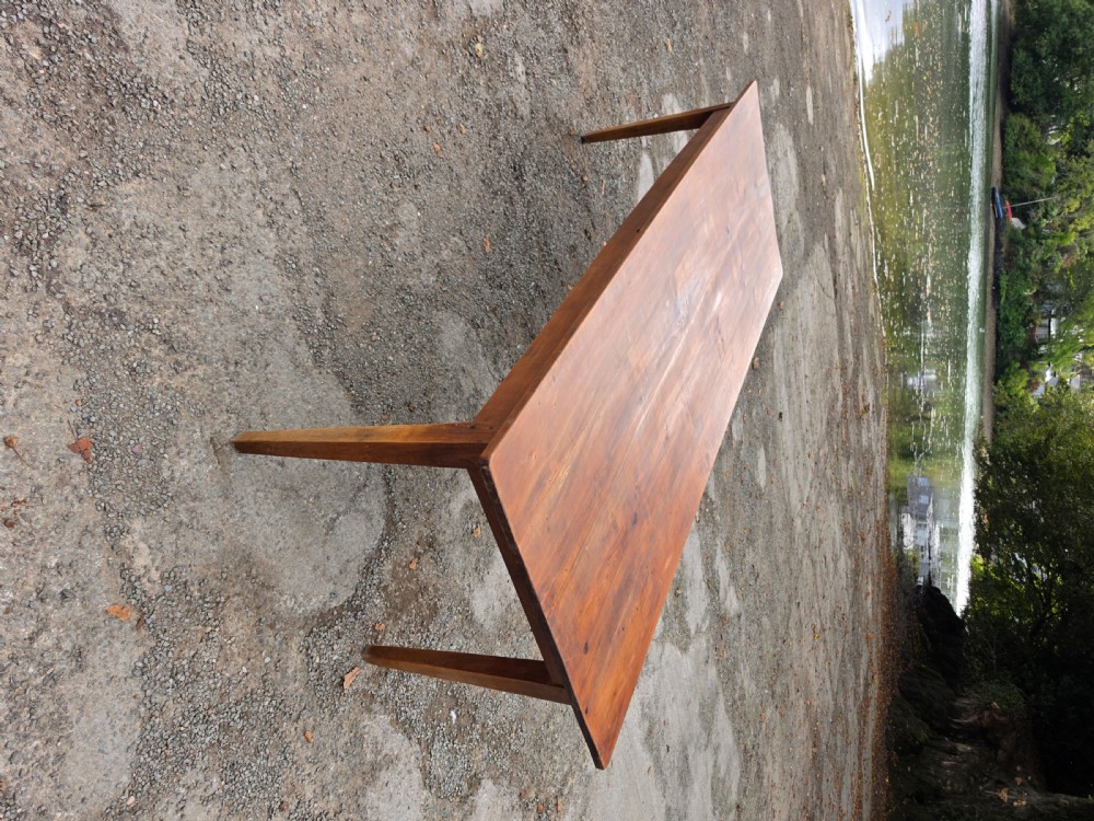 A long French provincial fruitwood farmhouse table featuring a plank top, single end drawer with a brass handle, and four tapered square legs. View IV
