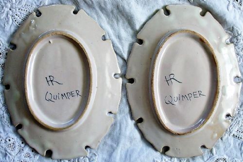 fig 1. A pair of oval French faience pin trays decorated with hand-painted Breton figures and navy blue scrollwork borders.