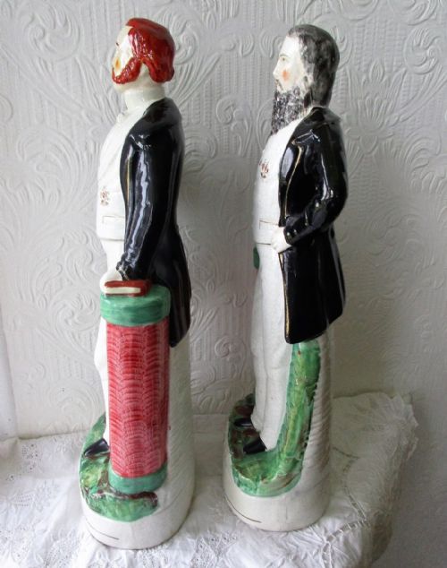 fig 1. A pair of antique Victorian Staffordshire earthenware portrait figures depicting Moody and Sankey standing beside red pedestals.