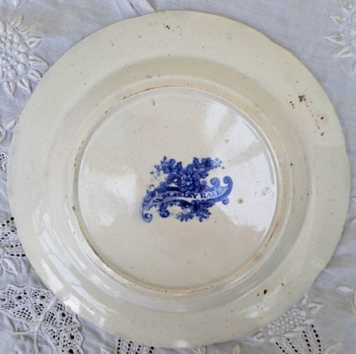 fig 1. A circular Georgian blue and white ceramic plate featuring a central landscape scene of Wolseley Hall framed by a wide floral border.