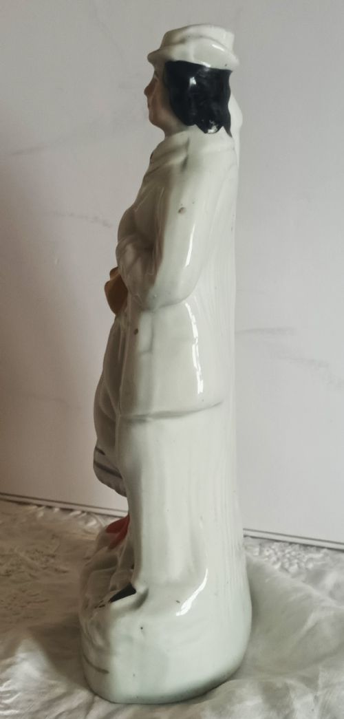 fig 1. An antique Victorian Staffordshire earthenware flatback figure depicting Princess Alice and Louis of Hesse with hand-painted enamels and gilt accents.