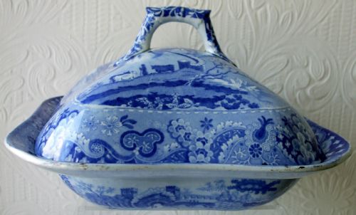 fig 1. A square Georgian blue and white transferware pottery vegetable tureen cover depicting a castle landscape pattern with a central moulded handle.