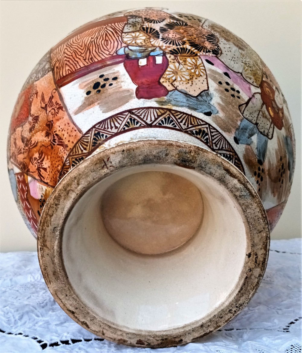 A Japanese Meiji period Satsuma earthenware vase decorated with hand-painted figures, bamboo-shaped handles, and gold gilding on a crackle glaze background. View VI
