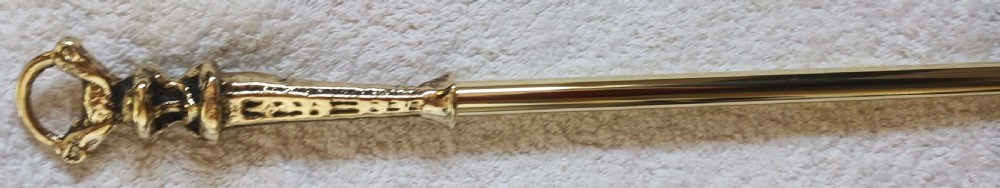 A three-piece set of Victorian brass fire irons comprising a poker, a shovel with a pierced scroll blade, and a pair of decorative tongs. View VI