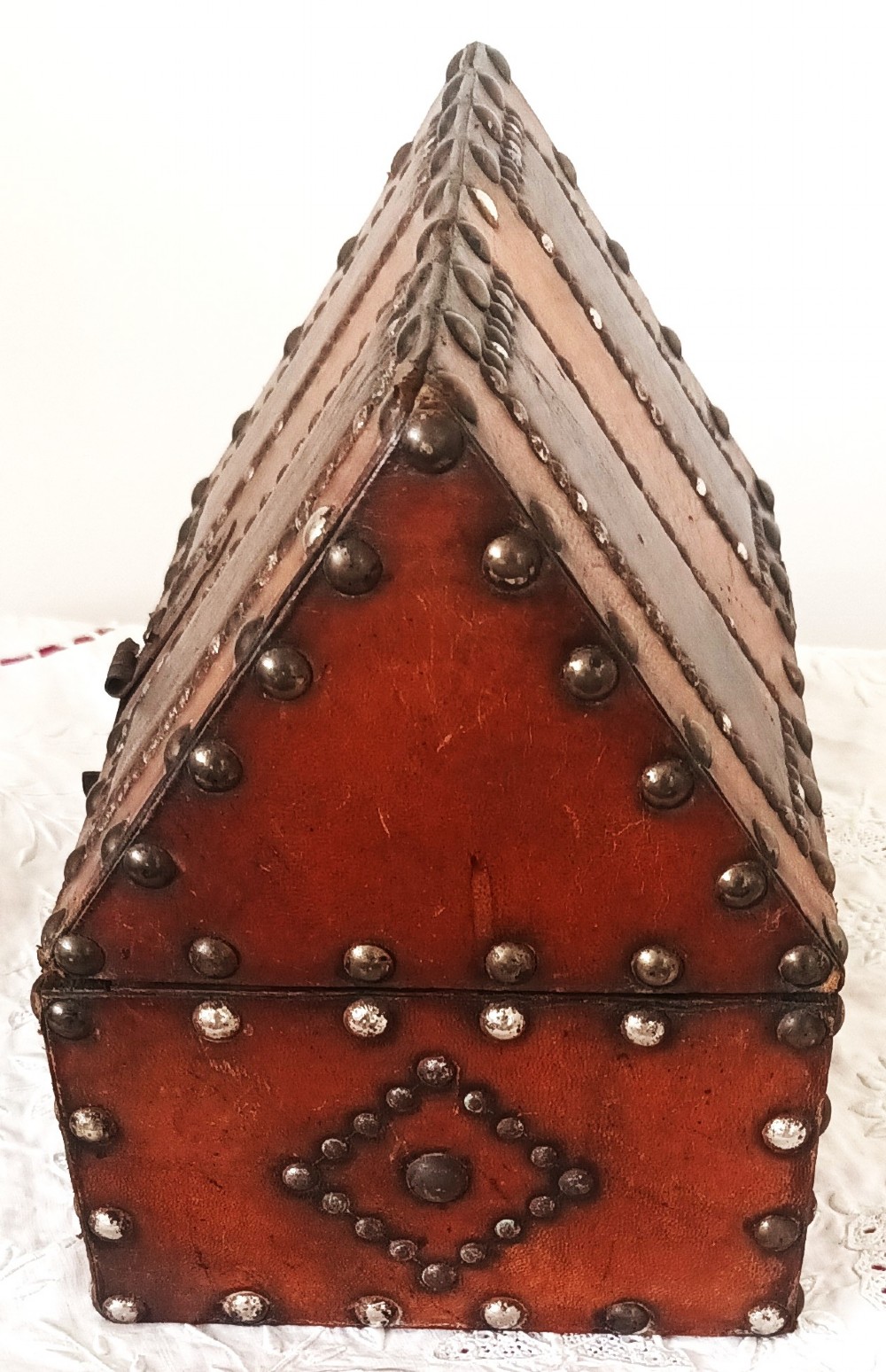 A rectangular Georgian leather-bound casket decorated with brass studs, etched military figure illustrations, and a central iron latch. View III