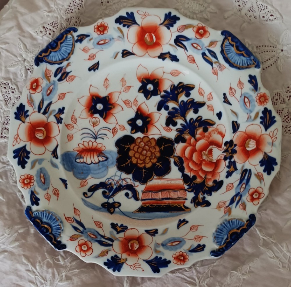 Set of six scalloped antique ironstone plates decorated with cobalt blue and terracotta floral Imari patterns with gilded details. View II