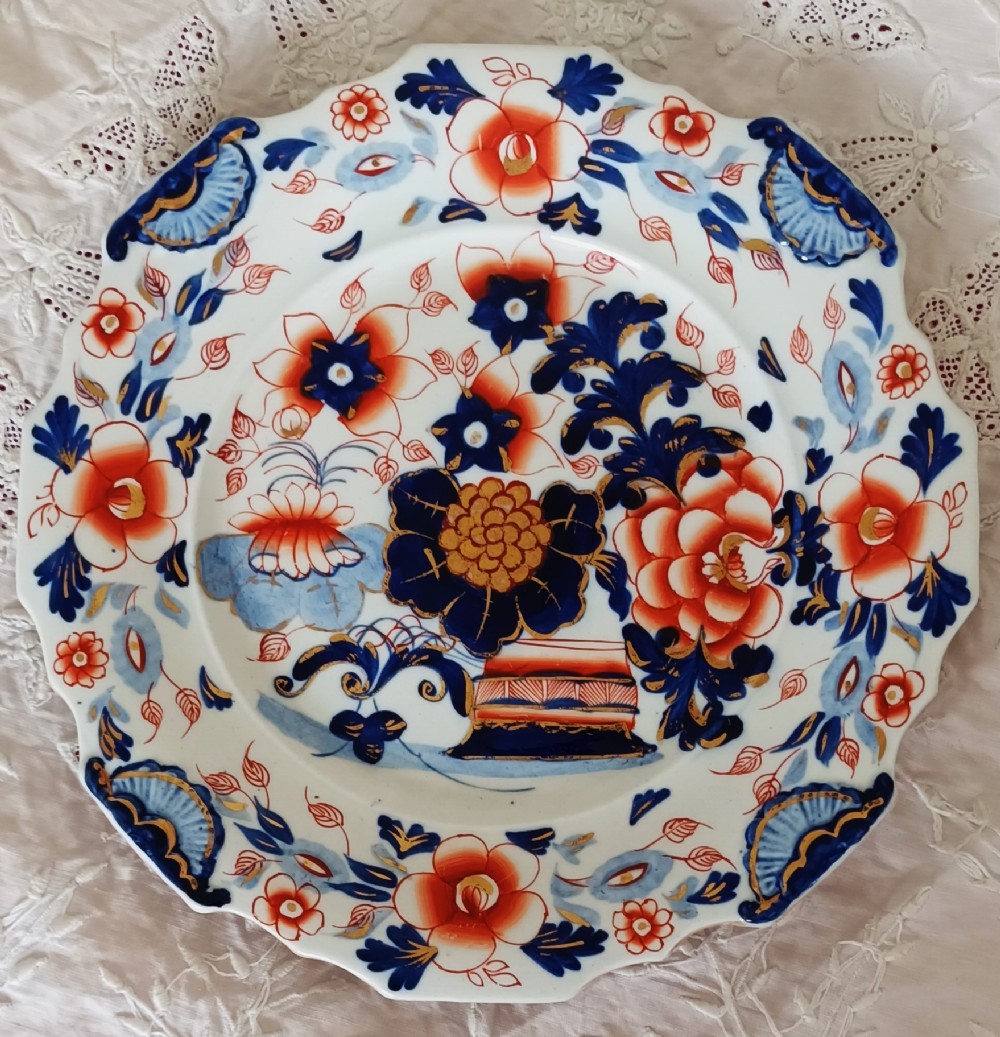 Set of six scalloped antique ironstone plates decorated with cobalt blue and terracotta floral Imari patterns with gilded details. View IV