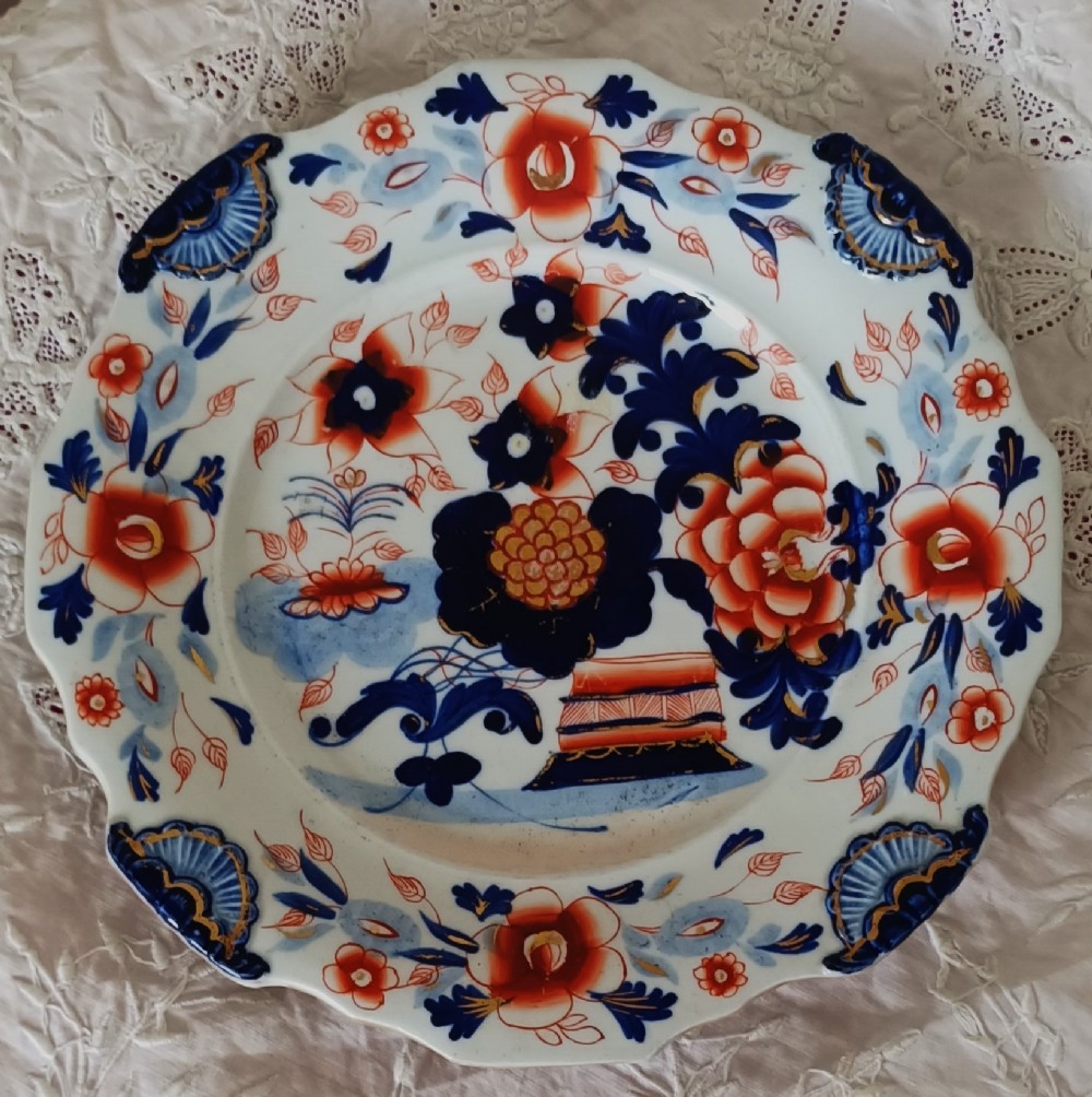 Set of six scalloped antique ironstone plates decorated with cobalt blue and terracotta floral Imari patterns with gilded details. View VIII