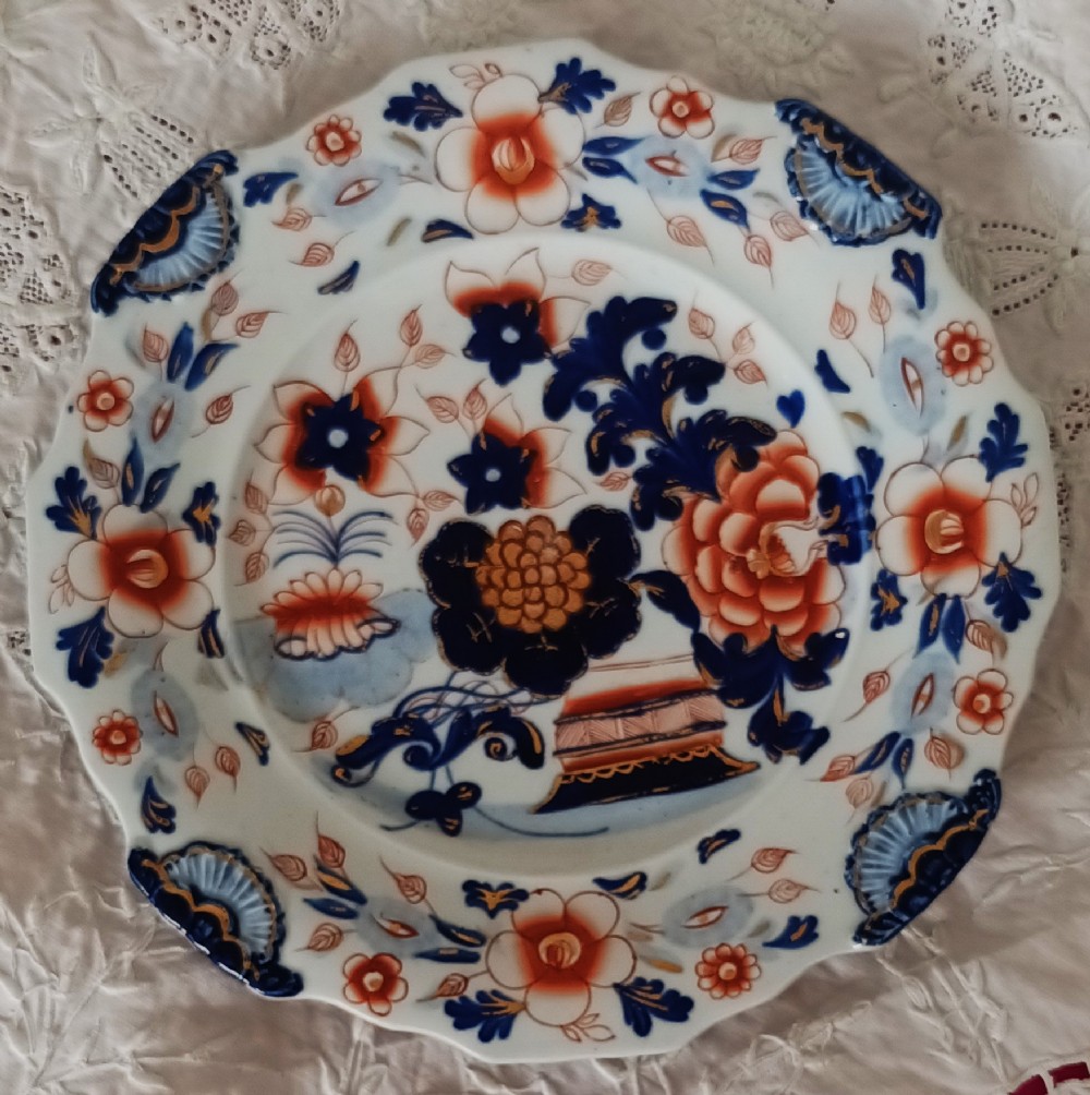 Set of six scalloped antique ironstone plates decorated with cobalt blue and terracotta floral Imari patterns with gilded details. View XII