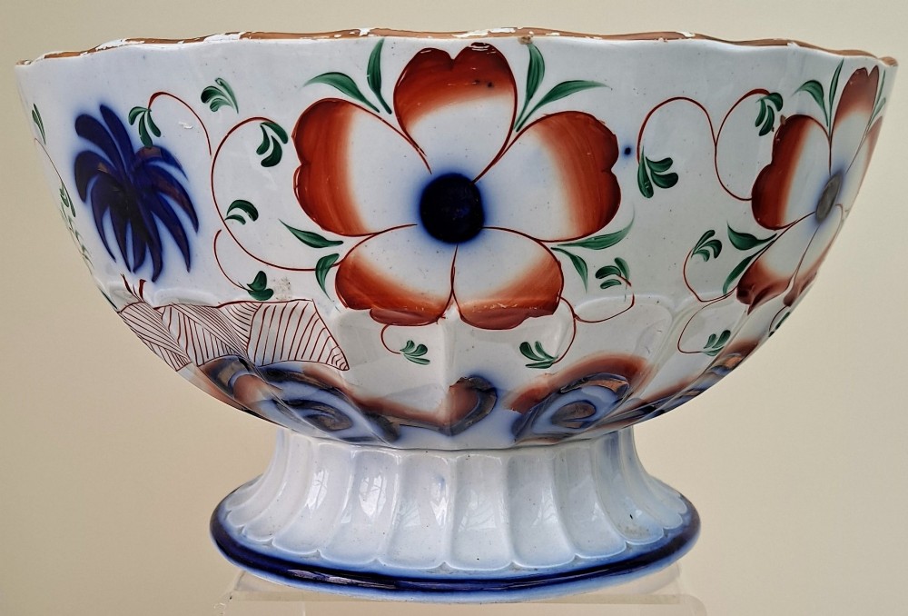 An antique Victorian earthenware footed bowl decorated with a cobalt blue and green hand-painted Pagoda pattern on a fluted pedestal base. View II