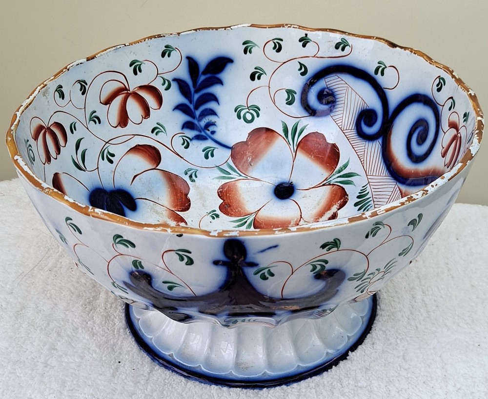An antique Victorian earthenware footed bowl decorated with a cobalt blue and green hand-painted Pagoda pattern on a fluted pedestal base. View V