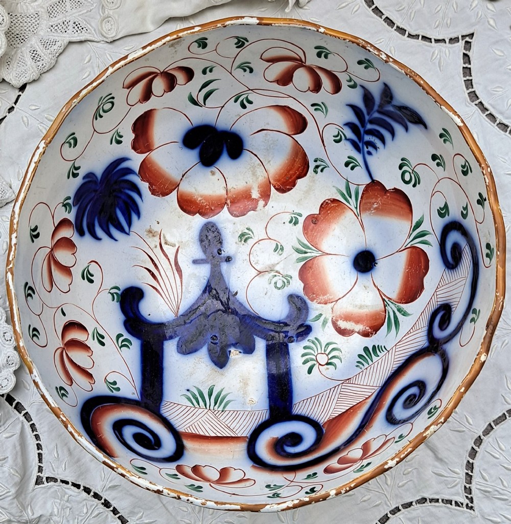 An antique Victorian earthenware footed bowl decorated with a cobalt blue and green hand-painted Pagoda pattern on a fluted pedestal base. View VI