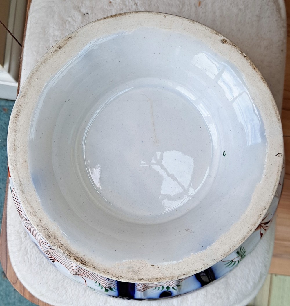 An antique Victorian earthenware footed bowl decorated with a cobalt blue and green hand-painted Pagoda pattern on a fluted pedestal base. View IX