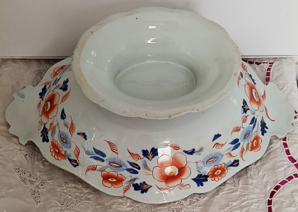 An oval ironstone footed comport decorated with an Imari Japan floral pattern in rust red, cobalt blue, and gold highlights. View V