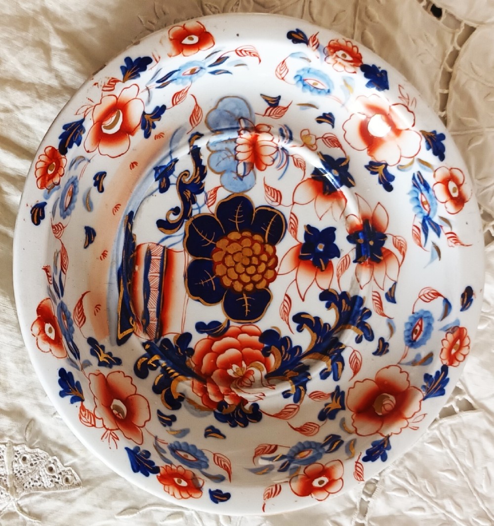 An antique Georgian ironstone china soup tureen with a lid and matching stand, decorated in an ornate Japanese Imari style pattern with cobalt blue, rust red, and gilded floral motifs. View VI