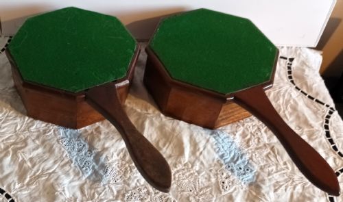 fig 1. A pair of antique octagonal wooden alms dishes with extended carved handles, crafted in warm brown timber.