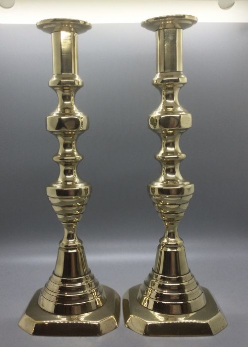 Early 19thc Pair of Graduated Brass Candlesticks C1820