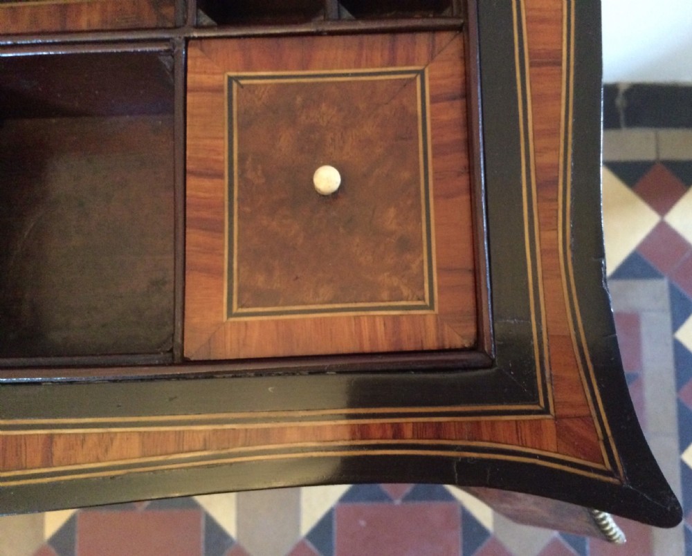 A late 19th-century burr walnut side table featuring serpentine edges, cabriole legs trimmed with brass studs, and a figured wood grain surface. View XV
