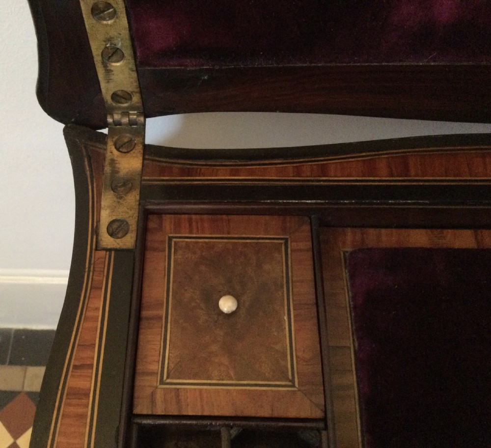 A late 19th-century burr walnut side table featuring serpentine edges, cabriole legs trimmed with brass studs, and a figured wood grain surface. View XVI