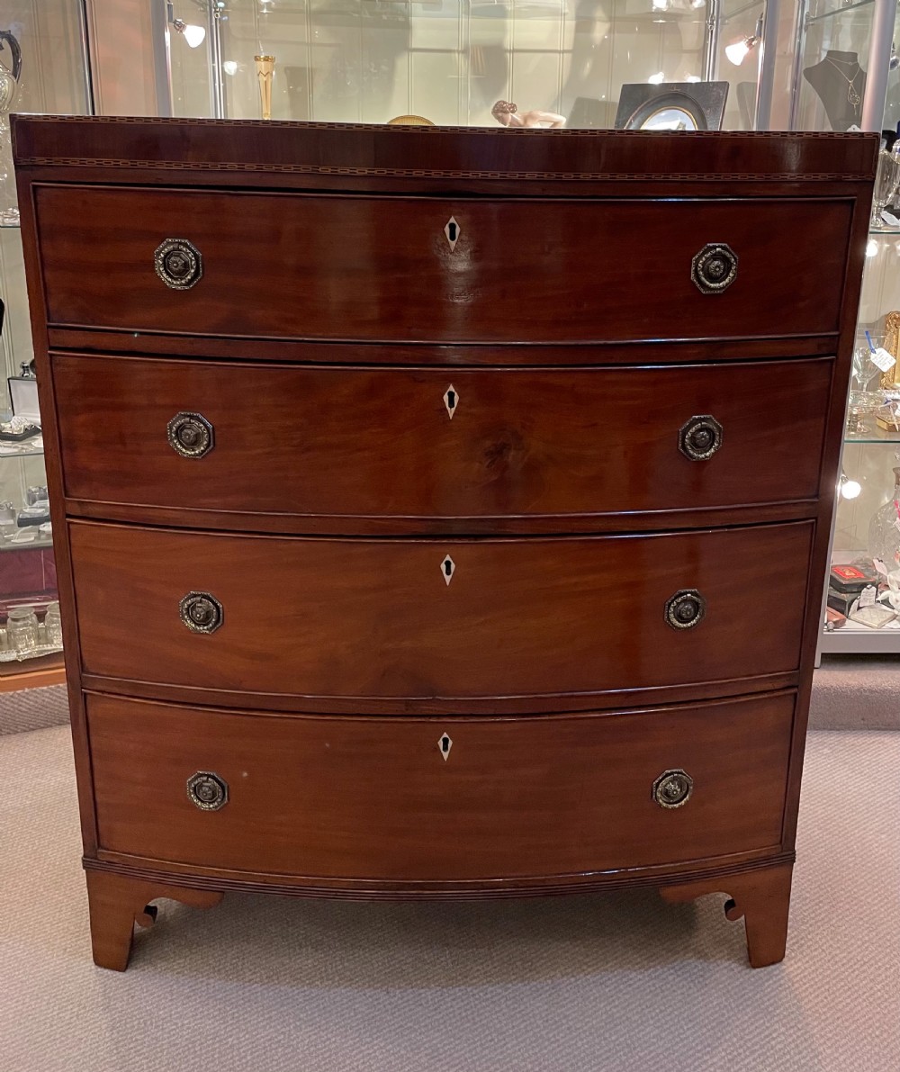 Early 19thc mahogany bow front four drawer chest c1820